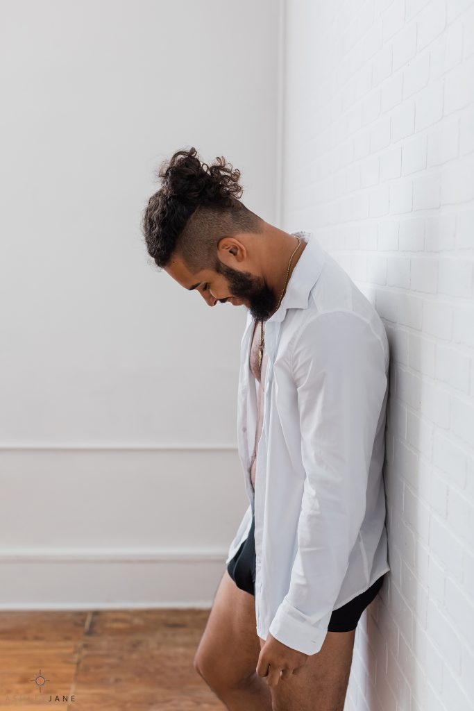 Individual boudoir image male with white collared shirt