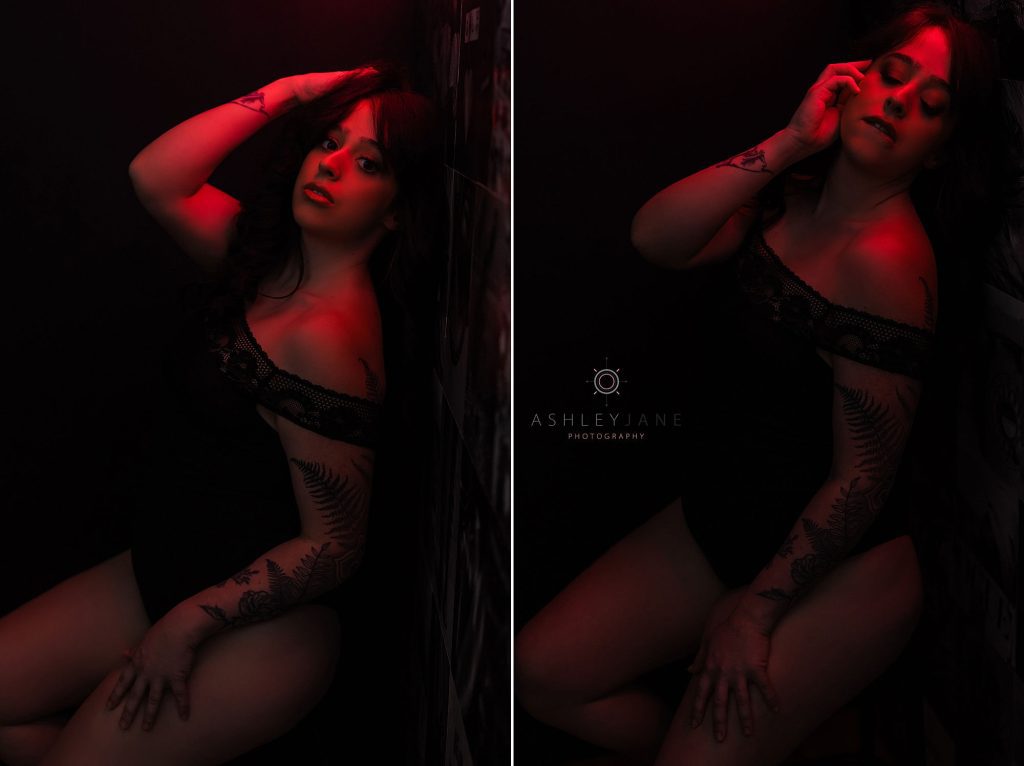 Moody photos of boudoir model sitting under a red light. 