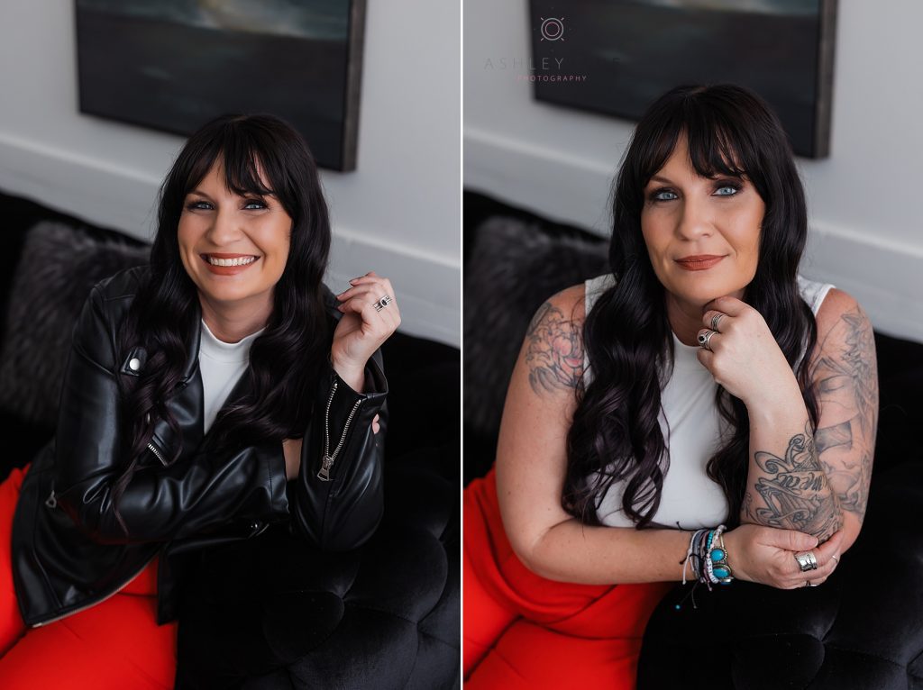 Beautiful tattooed model and photographer with long dark and wearing red pants and black leather jacket over a white tank top.
